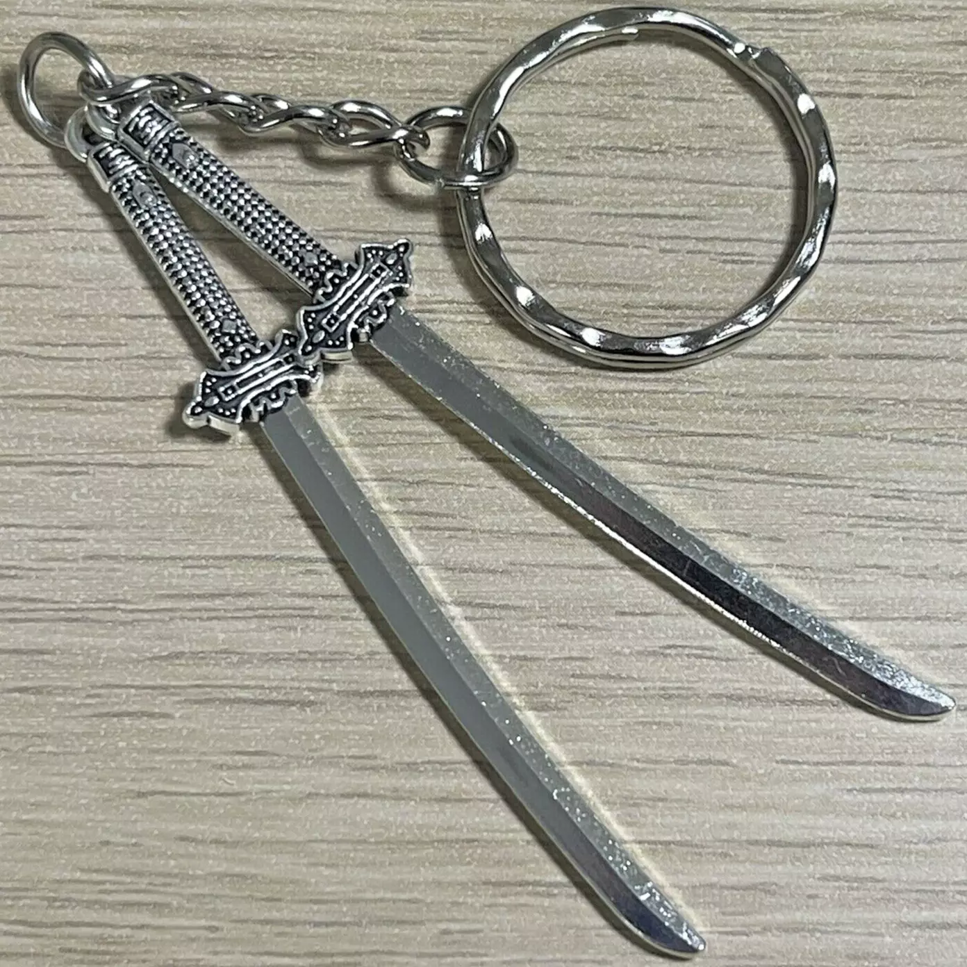 Close-up of samurai katana keychain used as workshop teaching prop